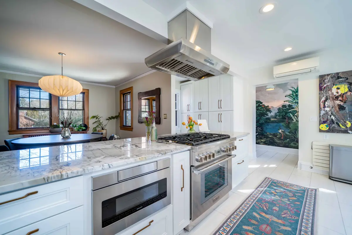 Remodeled kitchen with new cabinets and countertops by Geek Construction Team in Asheville, NC
