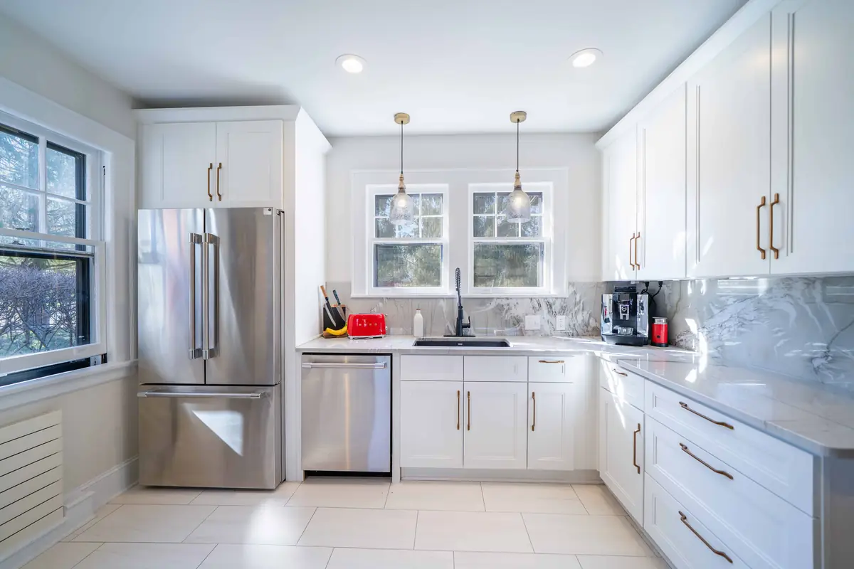 Kitchen remodel with a farmhouse sink by Geek Construction Team in Asheville, NC